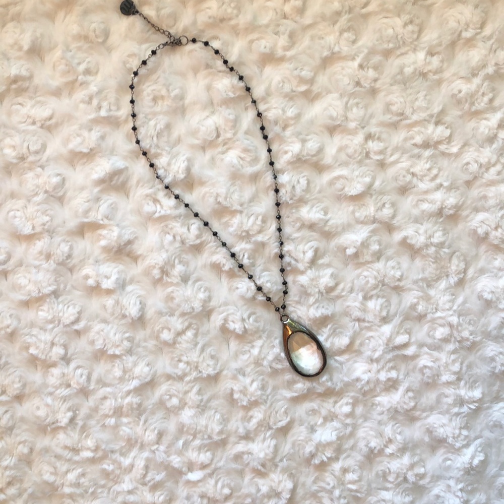 Black beaded necklace with clear pendant